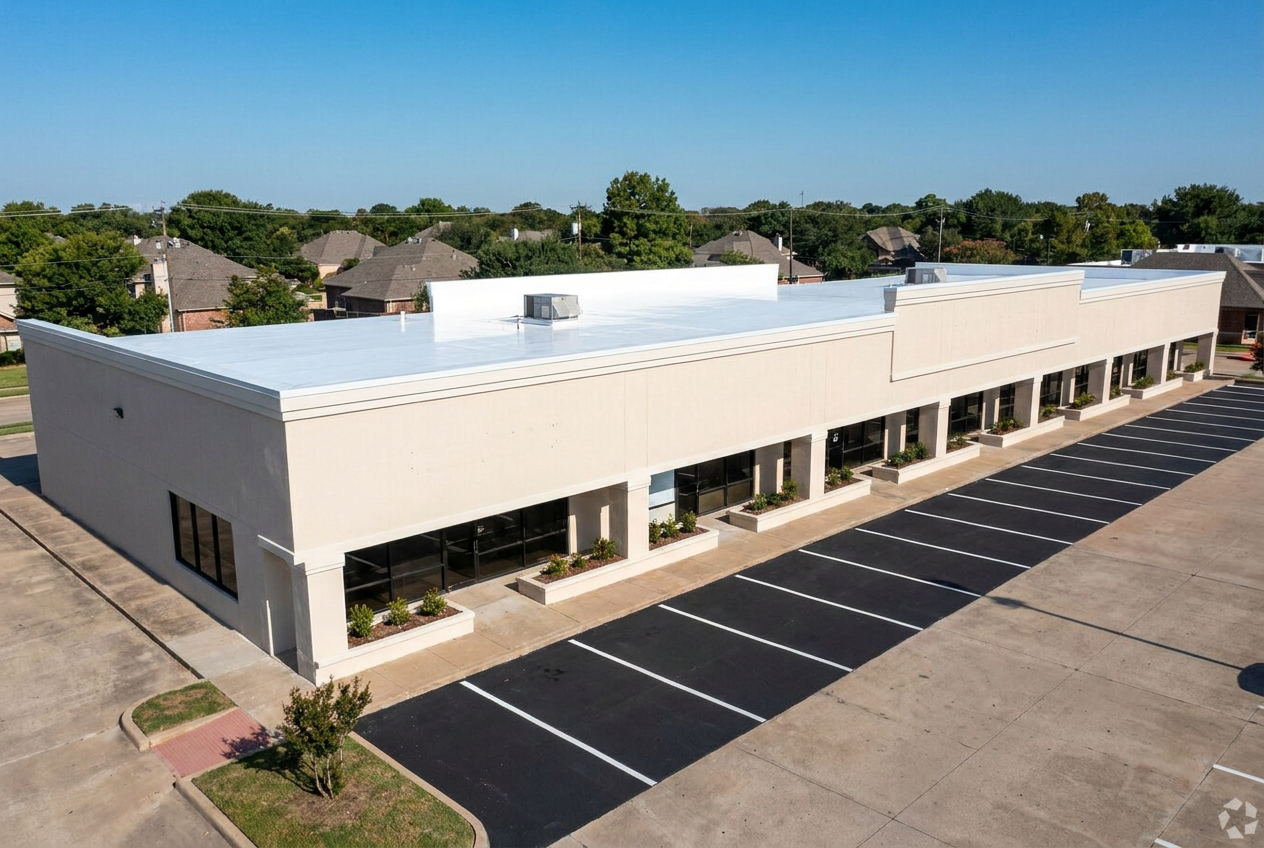 Commercial retail building with a new white TPO flat roof